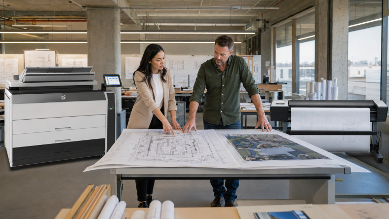 blueprint-printer-leasing-kip-vs-inkjet - STAT Business Systems - STAT Business Systems Architect and project manager comparing a KIP toner printer and inkjet plotter for blueprint printing