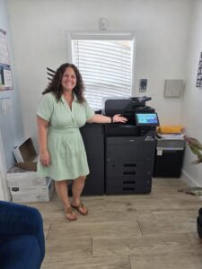 Kyocera MZ Series Copier for a Family Therapy Office - STAT Business Systems - STAT Business Systems Family therapy organization employee with new Kyocera MZ Series copier in South Florida