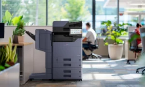 Copier Hole Punching Test the Binder Before Ordering featured image - STAT Business Systems - STAT Business Systems Kyocera multifunction copier with finishing equipment in an office